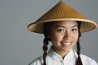 Young woman in traditional Chinese dress smiling at camera - Asia Images Group