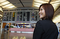 Young woman in departure lounge at the airport - Asia Images Group