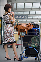 Young woman waiting at the airport - Asia Images Group