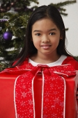 Girl with Christmas present - Asia Images Group
