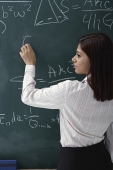 Woman at chalk board - Asia Images Group