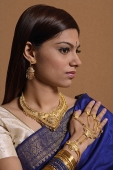 Indian woman wearing traditional wedding jewelry - Asia Images Group