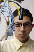 nerd holding up computer cords - Asia Images Group