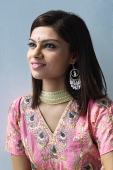 Young woman dressed in traditional Indian clothing (salwar kameez) - Asia Images Group