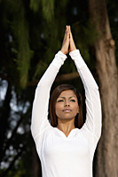 woman practicing yoga outside - Asia Images Group