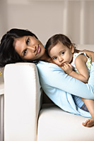 woman cradling baby - Asia Images Group