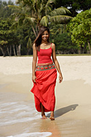 woman walking along the shore - Asia Images Group