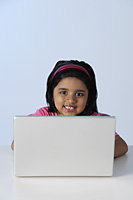 Little girl at laptop computer - Asia Images Group