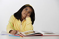 Girl working with color pencils and book - Asia Images Group