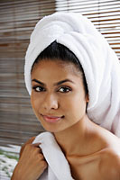 Indian woman looking at camera with towel on her head - Asia Images Group