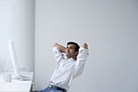 Indian man relaxing in front of the computer - Asia Images Group