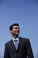 Indian businessman smiling outside. - Asia Images Group