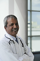 Head shot of Indian Doctor smiling - Asia Images Group