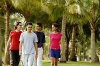Group of young adults walking in park - Asia Images Group