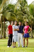 Young adults standing in park, looking at camera - Asia Images Group
