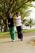 Young men jogging in park - Asia Images Group