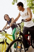 Two young men on bicycles, low angle view - Asia Images Group