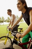 Two young men cycling - Asia Images Group