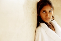 Woman in bathrobe, looking at camera, portrait - Asia Images Group