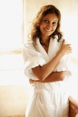 Woman in bathrobe, looking at camera, smiling - Asia Images Group
