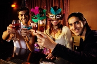 Couples at bar, holding drinks, looking at camera - Asia Images Group