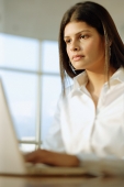 Woman using laptop - Asia Images Group
