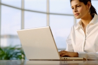 Businesswoman using laptop - Asia Images Group