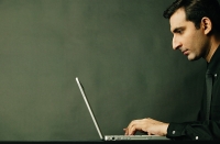 Man using laptop, profile - Asia Images Group