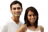 Couple smiling at camera, head shot - Asia Images Group