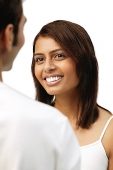 Woman smiling at man in front of her - Asia Images Group