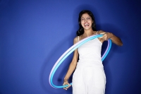 Woman with hoola hoop - Asia Images Group