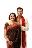 Indian couple in traditional clothing, looking at camera - Asia Images Group