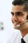 Executive using headset, head shot - Asia Images Group