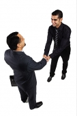 Two businessmen shaking hands - Asia Images Group