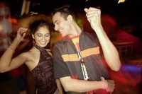 Couple dancing in night club - Asia Images Group