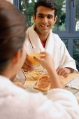 Couple having breakfast at home - Asia Images Group