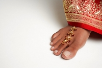 Close-up of woman's feet with traditional Indian toe ring - Asia Images Group