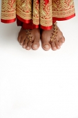 Woman's feet standing on white floor - Asia Images Group