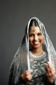 Woman in gray sari looking at camera, portrait - Asia Images Group