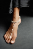 Close-up of woman's feet with traditional Indian toe ring and anklet - Asia Images Group