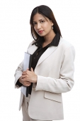 Businesswoman looking up at camera, holding folders - Asia Images Group
