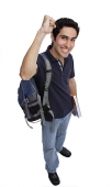 College student looking at camera, raising a fist, smiling - Asia Images Group