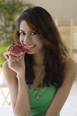 A woman eating fruit - Asia Images Group