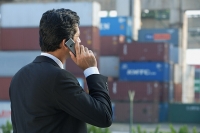 Businessman talking on mobile phone - Asia Images Group