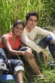 Young couple taking a break, smiling at camera - Asia Images Group
