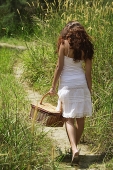 Young woman going for a picnic - Asia Images Group