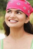 Young woman with bandana smiling at camera - Asia Images Group