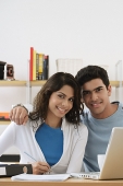 Young couple smiling at camera - Asia Images Group