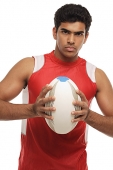 Young man with rugby looking at camera - Asia Images Group