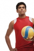 Young man with beach ball looking at camera - Asia Images Group